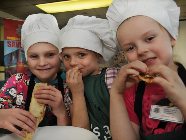 Sara Bramley, Kaitlyn Darcy and Lucy Darcy tucked into pancakes during a safe cooking day at County Durham and Darlington Fire and Rescue HQ at Framwellgate Moor in 2012.