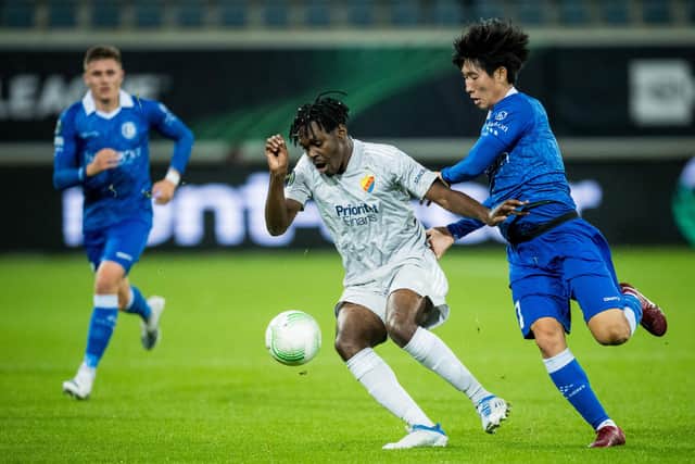 Djurgardens' Swedish forward Joel Asoro (L) fights for the ball with Gent's South Korean midfielder Hyun-seok Hong during the UEFA Europa Conference League