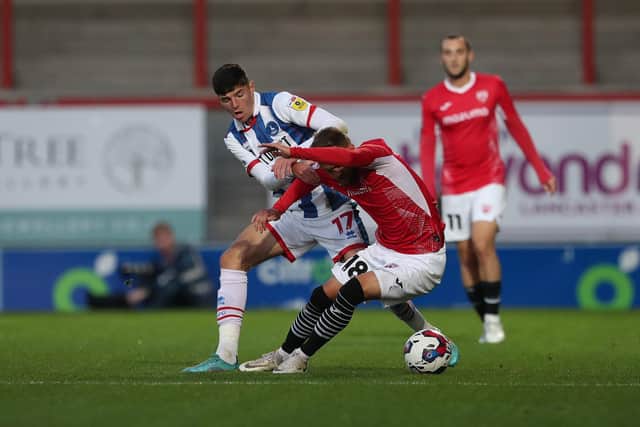 Hartlepool United's Ellis Taylor battles for possession with Morecambe's Shane McLoughlin during the EFL Trophy match between Morecambe and Hartlepool United at the Globe Arena. (Credit: Mark Fletcher | MI News)