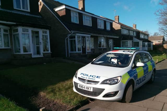 A police car remains parked outside the house on Satley Gardens, off Essen Way.