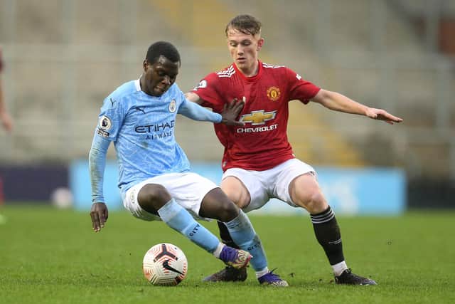 Claudio Gomes of Manchester City on the ball with Ethan Galbraith of Manchester United.