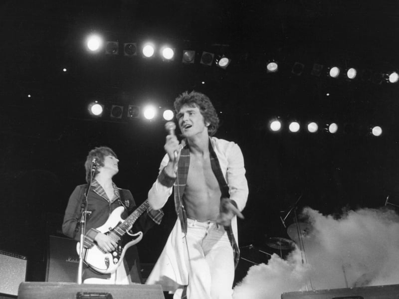 The Bay City Rollers, playing at the Budokan in Tokyo, where young girls fainted with excitement and had to be carried out by policemen and attendants. (Photo by Keystone/Getty Images)