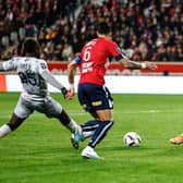 Lille's French goalkeeper Lucas Chevalier (R) stops the ball in front of Clermont-Ferrand's French forward Grejohn Kyei (L) during the French L1 football match between Lille LOSC and Clermont Foot 63 at Pierre-Mauroy stadium in Villeneuve-d'Ascq, northern France on February 1, 2023. (Photo by Sameer Al-DOUMY / AFP) (Photo by SAMEER AL-DOUMY/AFP via Getty Images)