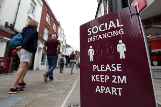 A social distancing sign. Picture: PA.