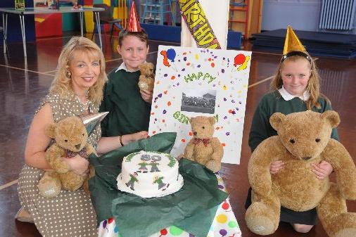 Head Teacher Pauline Wood with Head Girl Brogan Walton 10, and Head Boy David Rowe 10, pictured with the cake during the 80th birthday celebrations at Grange Park Primary School, Sunderland, in 2011.