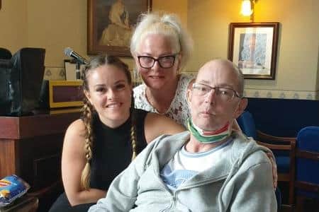 Andrew with his daughter Jessica and wife Elaine during cancer battle