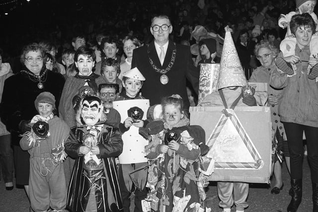 The Mayor of Sunderland Cllr Tom Scott and the Mayoress Mrs Winnie Scott with winners of the 1986 torchlight parade fancy dress competition - were you under one of the masks?