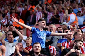 Sunderland fans celebrate after their team score the first goal during the Sky Bet Championship between Stoke City and Sunderland(Photo by Clive Brunskill/Getty Images)