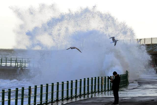 Waves crashing against Seaburn promenade during high tides and big swell.