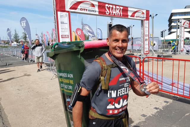 Refuse collector Deano Franciosy ran the 5km and 10km races with a bin strapped to his back.
