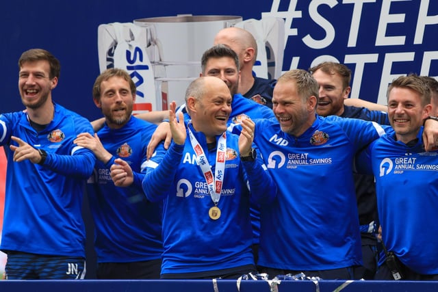 Alex Neil and hos coaching staff celebrate the Wembley win