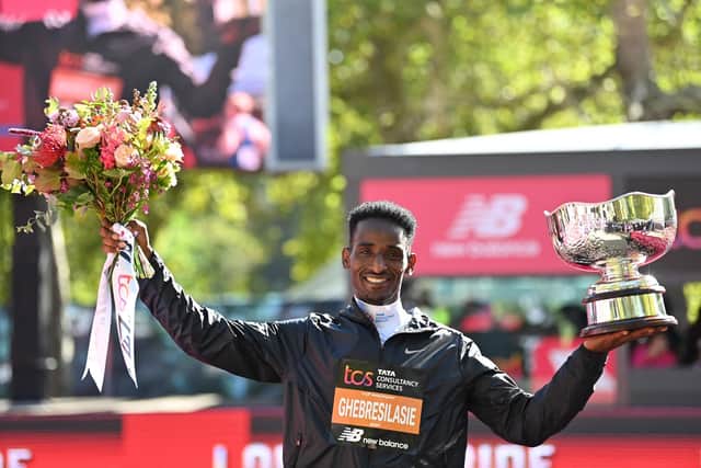 Best British finisher, Britain's Weynay Ghebresilasie poses with his trophy at the presentation for the men's race in the 2022 London Marathon in central London on October 2, 2022. (Photo by Glyn KIRK / AFP) / Restricted to editorial use - sponsorship of content subject to LMEL agreement. (Photo by GLYN KIRK/AFP via Getty Images)
