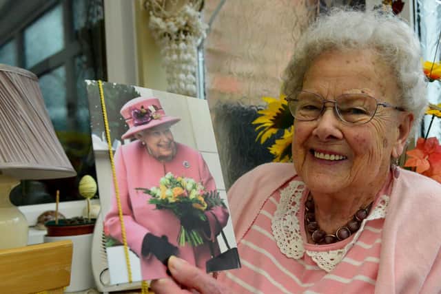 Annie Crompton holding her 100th birthday card from The Queen. Picture by Frank Reid