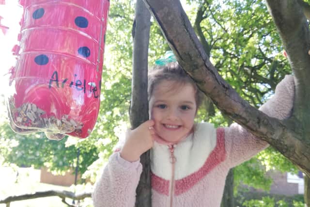 Arielle has been creating bird feeders out of recycled plastic bottles and hanging them for her friends to see.
