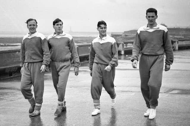 Len Shackleton is among the Sunderland players taking a seafront walk.