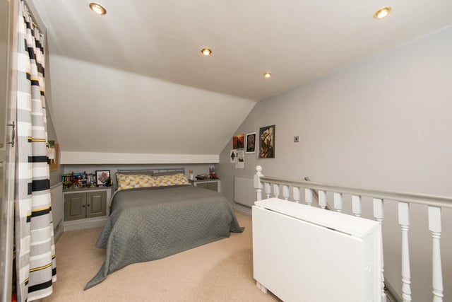 This one of three bedrooms, which the brochure describes as well-proportioned.