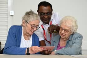 Sunderland City Council's Falls Co-ordinator Pradeep Chockalingam showing residents the Steady on Your Feet website.