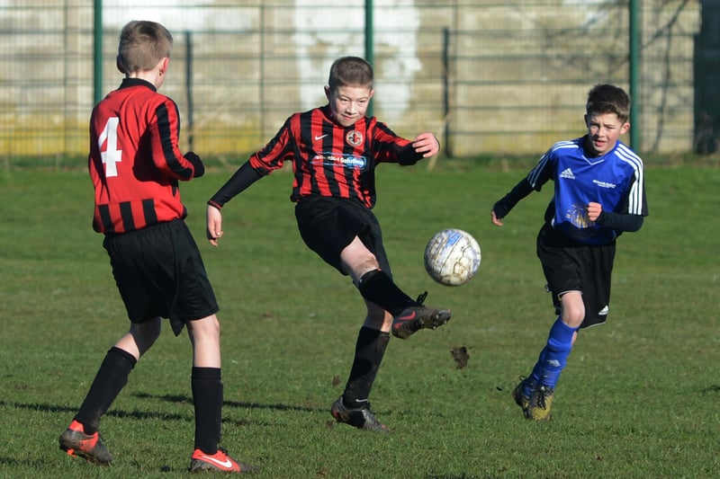 Manor FC and Blidworth Welfare battle it out in the Chad Mansfield Youth Football League in 2013.