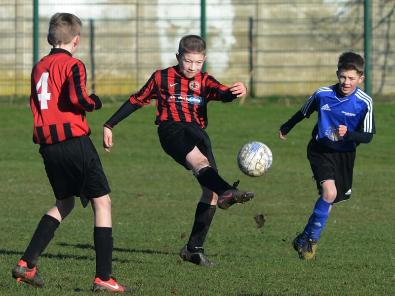Manor FC and Blidworth Welfare battle it out in the Chad Mansfield Youth Football League in 2013.