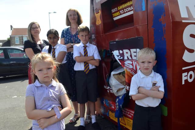 Front Grace Pinkerton, 5 and Jake Laws, 5. Back Cole Foster, 10 and Riya Ruby, 11 with teaching assistant Sophie Everett and headteacher Stephanie Brown