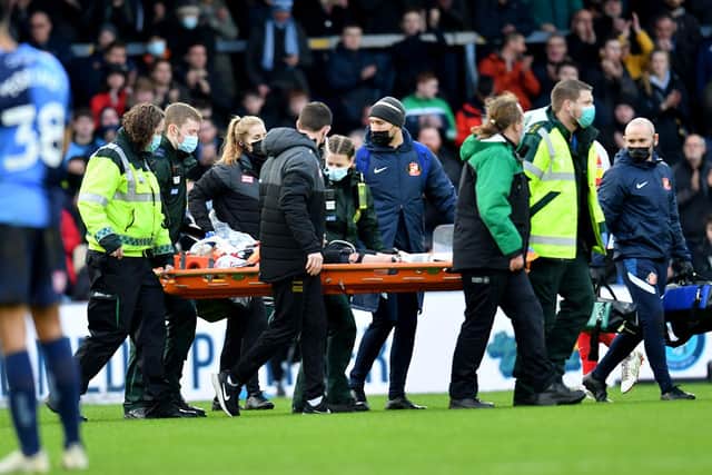 Corry Evans stretchered off against Wycombe.