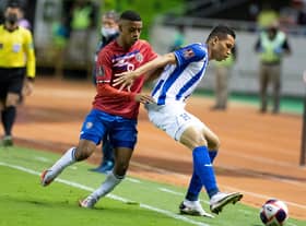 Costa Rica's Jewison Bennette (L) vies for the ball with Honduras´ Carlos Melendez during their FIFA World Cup Qatar 2022 Central American qualifier match at the Romel Fernandez stadium in Panama City on November 16, 2021. (Photo by Ezequiel BECERRA / AFP) (Photo by EZEQUIEL BECERRA/AFP via Getty Images)