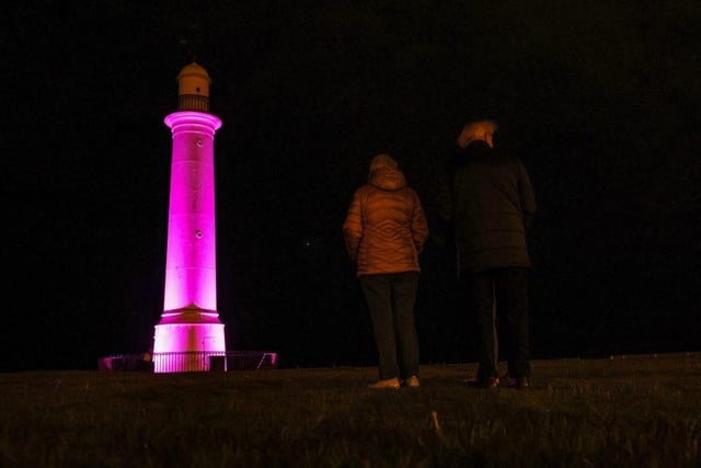 Two people pause for thought outside the Lighthouse at Cliffe Park ahead of the funeral of Queen Elizabeth II.

Photograph: Will Walker / NNP