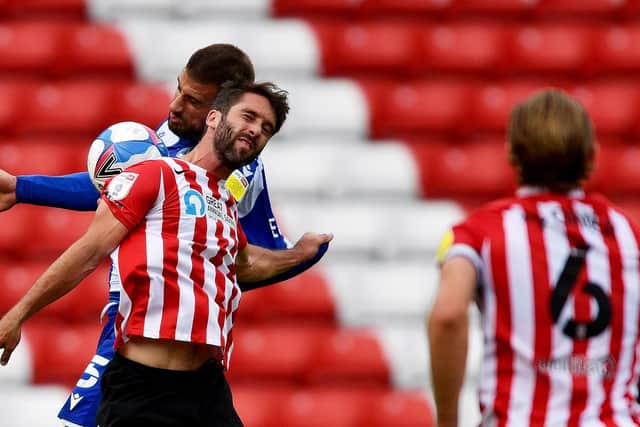 Will Grigg battles for the ball in the 1-1 draw between Sunderland and Bristol Rovers.