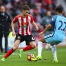 SUNDERLAND, ENGLAND - MARCH 05: Adnan Januzaj of Sunderland (L) attempts to take the ball past Gael Clichy of Manchester City (R) during the Premier League match between Sunderland and Manchester City at Stadium of Light on March 5, 2017 in Sunderland, England.  (Photo by Alex Livesey/Getty Images)