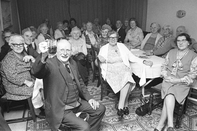 The oldest resident of Lord Gort Close Royal British Legion Flatlets, James Walsh, raises his glass at a party in the flats in 1976.