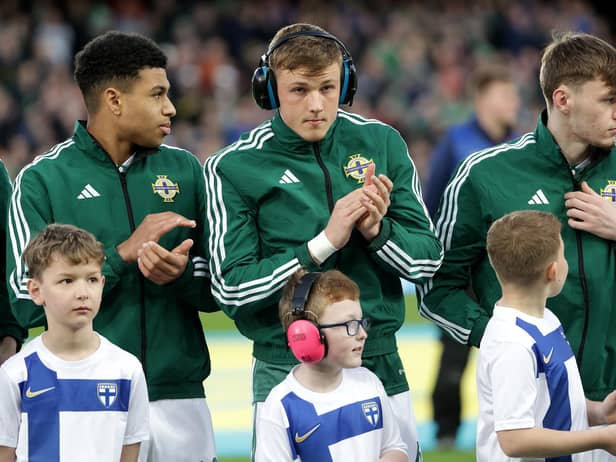 Northern Ireland player Daniel Ballard and eight-year-old mascot Charlie Kerrigan wearing ear defenders before Sunday's EURO 2024 qualifier against Finland.
Credit: PressEye Ltd