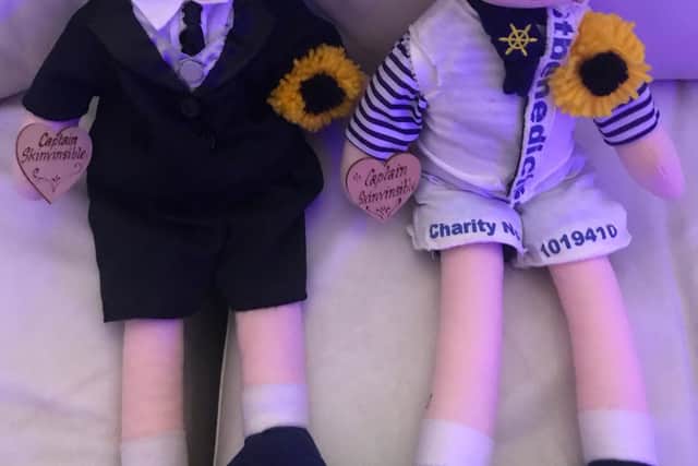 Two dolls representing Debbie's late husband Lee and granddaughter Dolcie will travel the world in aid of charity.