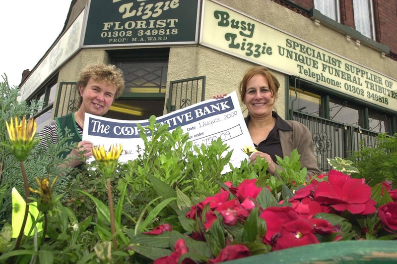 Florists Busy Lizzie received a SRB Commercial Grant of just over £750 towards the cost of upgraded its security system in 2000. Our picture shows Marilyn Green (right), Community Safety Co-ordinator SRB2, handing over the cheque to shop owner Margaret Ward. The shop is in Hyde Park.