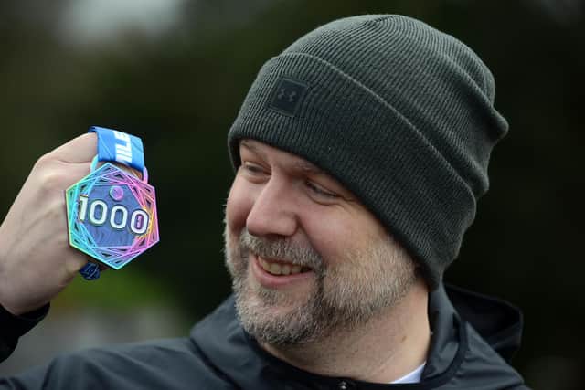 Chris Johnson has celebrated running 1,000 miles in 12 months after Virtual Runner UK made an exception and sent him a medal for the achievement.
