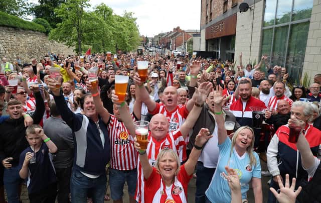 Fans celebrate in Sunderland city centre as the club return to the Championship after four seasons in League One.