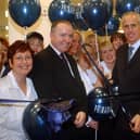 Former Sunderland manager Mick McCarthy cut the ribbon to open the new shop with staff looking on.
