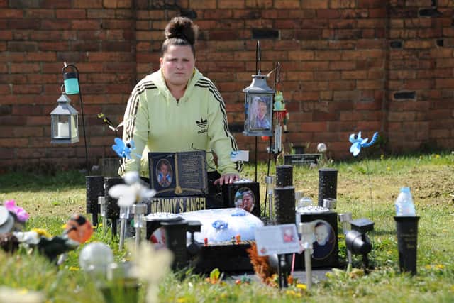 Katrina Keegan pictured at her son's grave