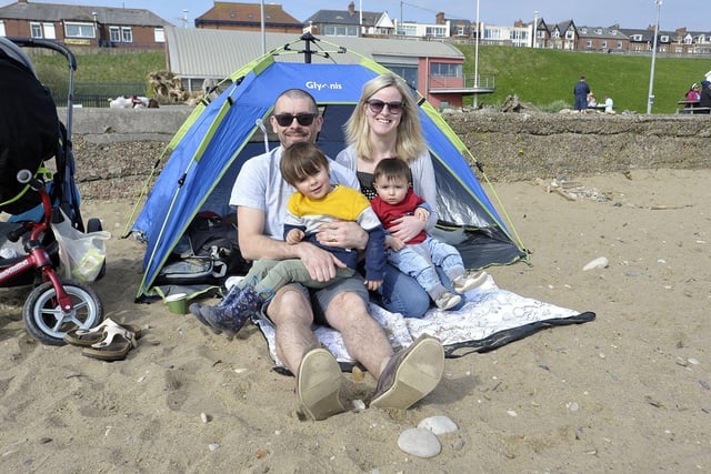 Husband and wife Richard Fielding and Pauline Devenney with their children Shay Fielding, three, and Rory Fielding, one, setting up camp for a day of fun at Roker Beach. 

Picture by FRANK REID