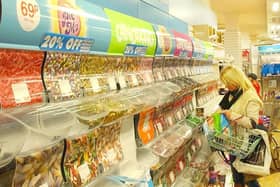 Which was your favourite pick 'n mix sweet? This shopper was grabbing a last bag before the Durham branch of Woolworths closed in 2008.