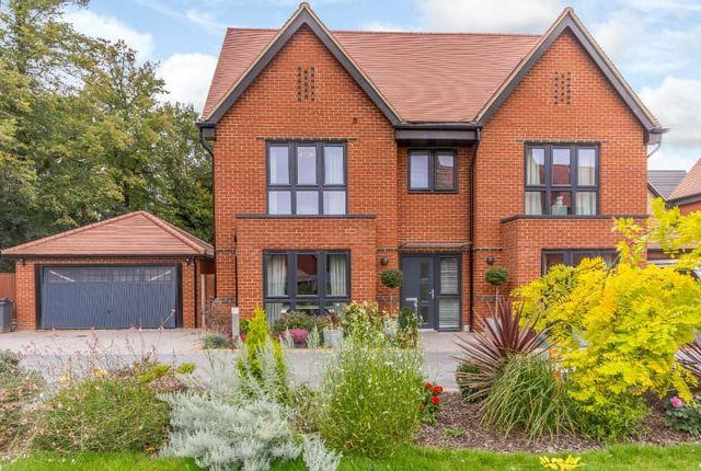 This five bedroom property benefits from a modern design, and is set over three floors. Three of the five bedrooms are en suite, including the principal bedroom suite, which occupies the upper floor of the house. There is also an open plan kitchen, a separate sitting room and study, and private paviour driveway with parking for several vehicles. Available for offers over £765,000.