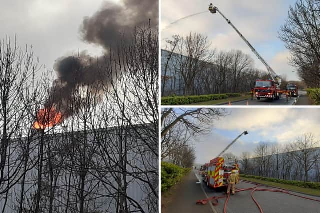 Firefighters at the scene of a second fire at the Komatsu factory