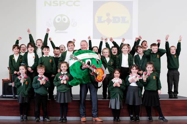 Pupils at Broadway Junior School in Sunderland and teacher John McCabe, who is wearing the NSPCC’s speech bubble mascot, Buddy. Picture by Stuart Boulton.