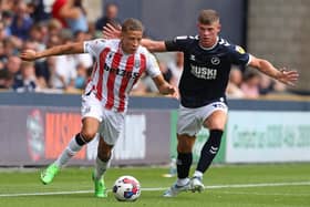 LONDON, ENGLAND - JULY 30: Dwight Gayle of Stoke City and Charlie Cresswell of Millwall during the Sky Bet Championship match between Millwall and Stoke City at The Den on July 30, 2022 in London, United Kingdom. (Photo by Henry Browne/Getty Images)