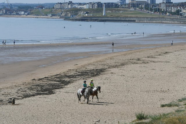 Early risers enjoy the sea and sand on Seaburn Beach as we entered the hottest days on record on July 18.