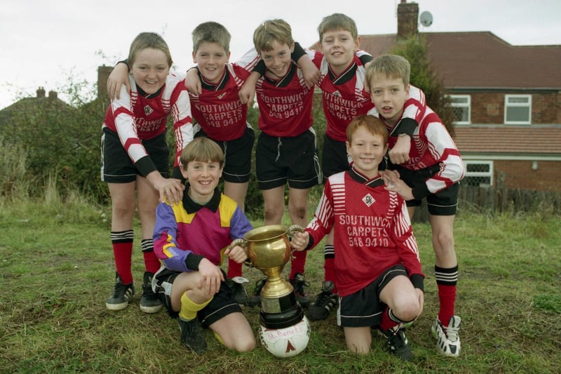 St Benet's Primary School team with the cup they won for the city under -11s tournament in 1996. Pictured Left to right at the back are:  James Smith, Neil Ebdon, Michael McVay, Anthony Douthwaite and Craig Hubbard.  Front: Martin McGill and Shaun Donkin, captain.
