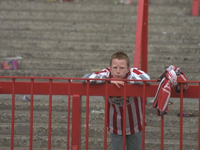 A Sunderland supporter waits behind after the last game to be played at Roker Park before moving to a new ground. Sunderland beat Everton 3-0 in the Premier League match back in 1997.