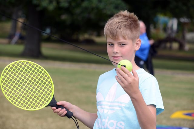 Theo Crann, 11, enjoying a game of swing-ball tennis at the family fun day at Thompson Park.