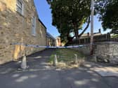 Police tape near to a lane off Cliff Road, in Ryhope, Sunderland, following a suspected stabbing.