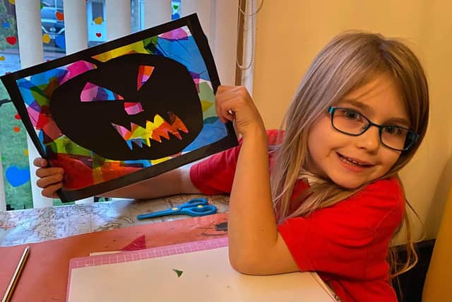 The Trail encourages children to make their own pumpkins and other artwork - and then go out and spot other people's pumpkins which have been placed in windows. Izzy Macrae shows off her artwork.