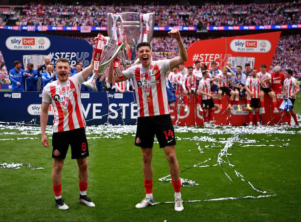 LONDON, ENGLAND - MAY 21: Elliot Embleton of Sunderland and Ross Stewart of Sunderland pose with the Sky Bet League One Play-Off trophy following victory in the Sky Bet League One Play-Off Final match between Sunderland and Wycombe Wanderers at Wembley Stadium on May 21, 2022 in London, England. (Photo by Justin Setterfield/Getty Images)